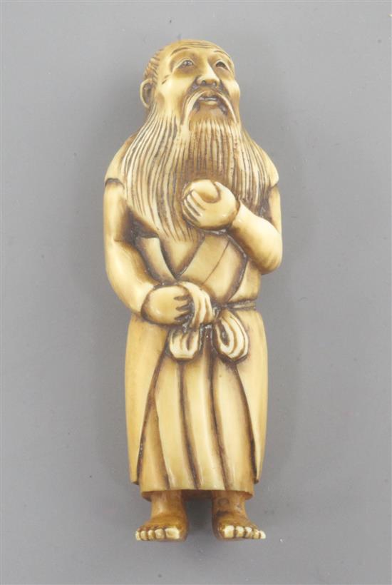 A Japanese ivory netsuke of a bearded man, 19th century, 6.2cm